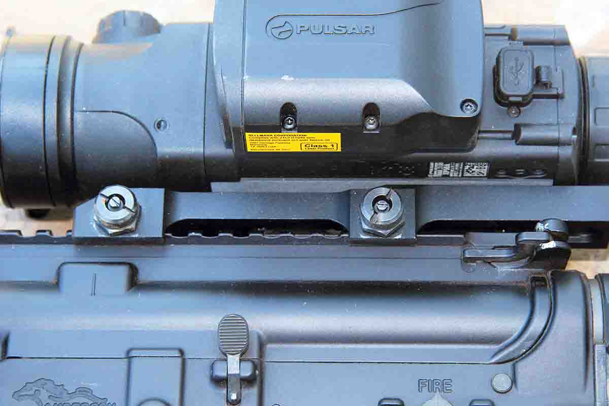 The Pulsar Trail 2 LRF Thermal Imaging Scope comes with an integral Picatinny mounting base. This one requires a wrench to tighten two side bolts and provides a rock-solid attachment to any flattop AR.